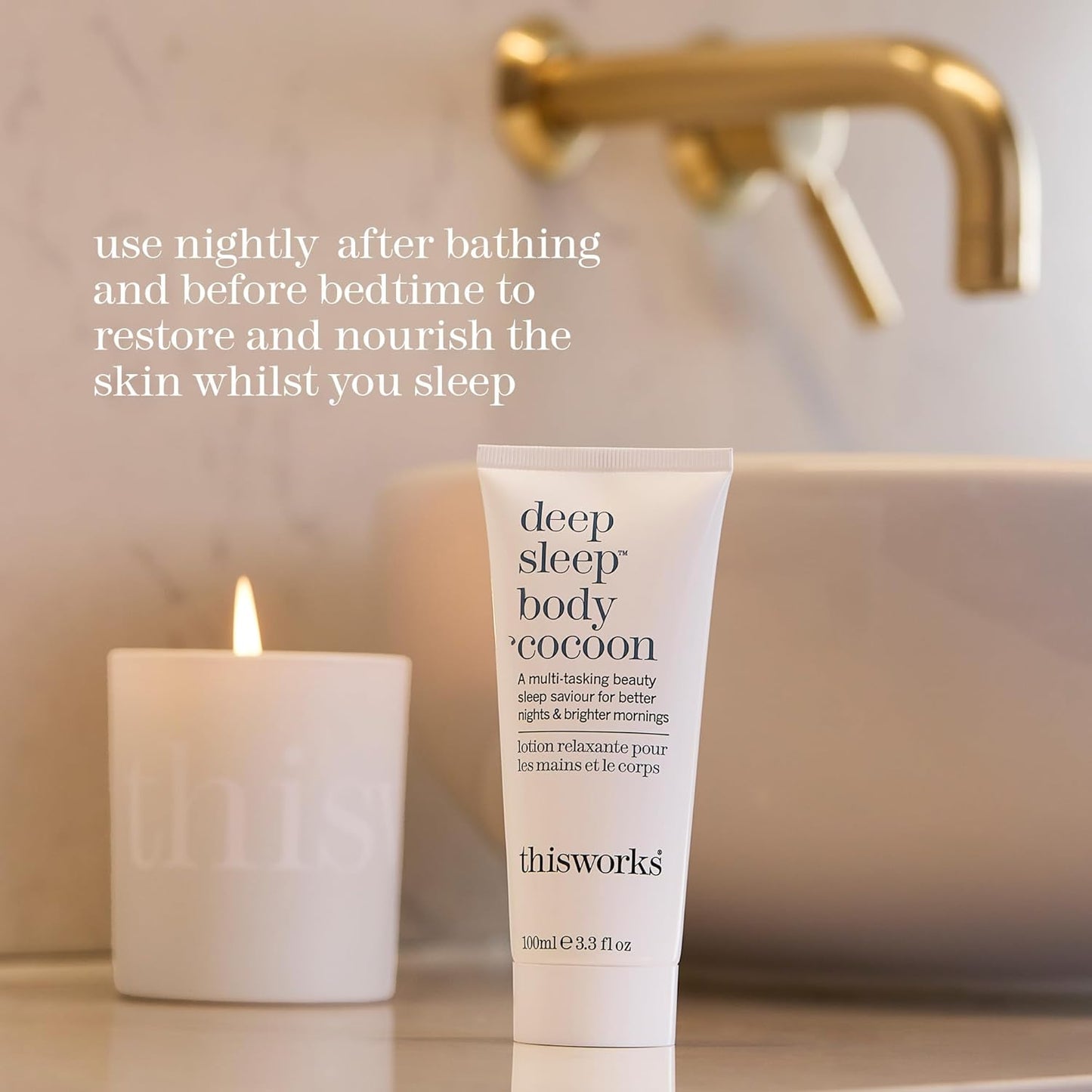 thisworks Tube of 'deep sleep body cocoon' lotion with a candle and bathtub in the background