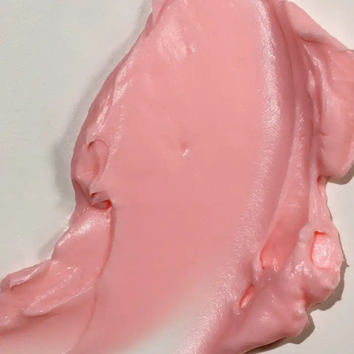 Close-up of pink, glossy TREE HUT Whipped Body Butter Watermelon on a white background