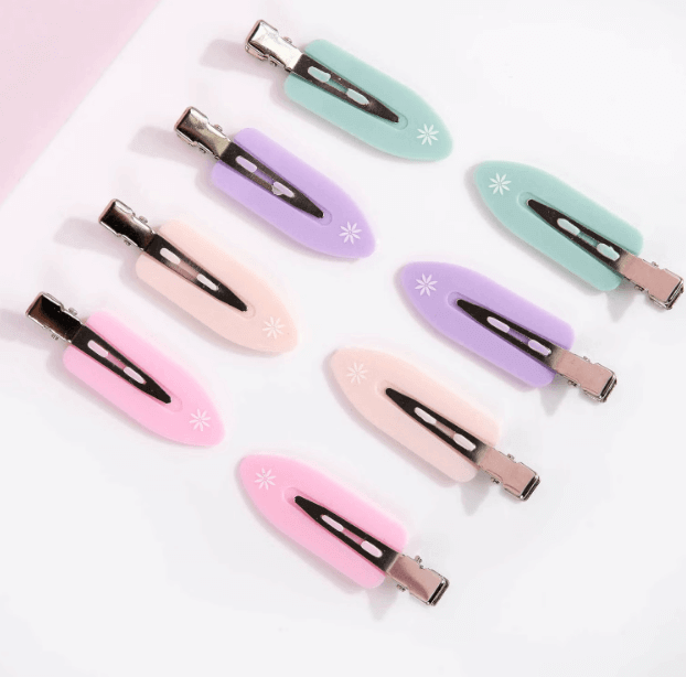 Brushworks No Crease Clips in soft pastel colors, ideal for styling hair without kinks or creases.