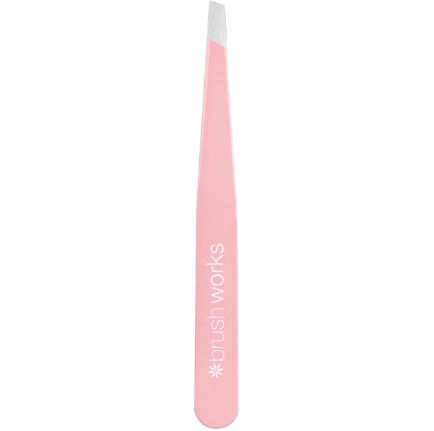 Brushworks Precision Slanted Tweezers in pink, crafted from stainless steel for eyebrow grooming and eyelash application.