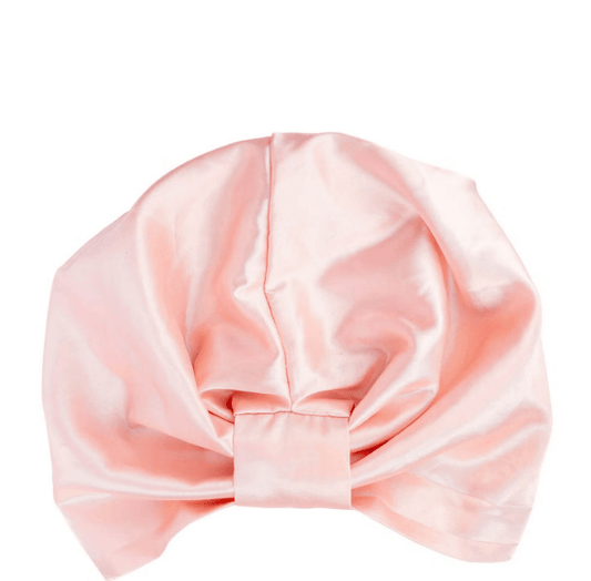 Brushworks Satin Hair Turban in soft pink, designed to minimize frizz and protect curls overnight.