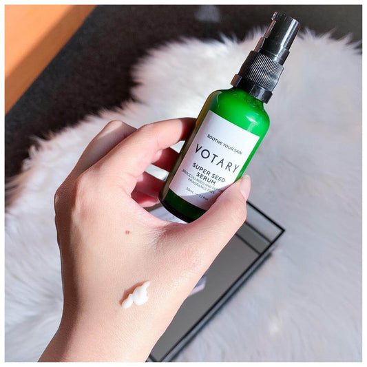Votary Super Seed Serum in hand, showing its calming properties and texture for sensitive skin.