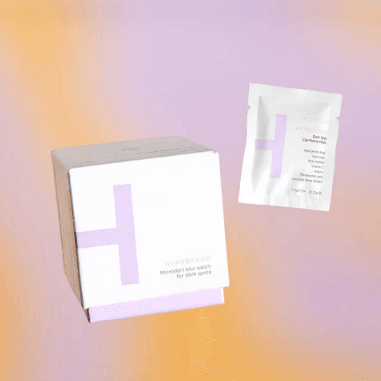 ZITSTICKA HYPERFADE dark spot patch box and sachet on a colorful background, designed to brighten skin and diminish post-pimple marks.