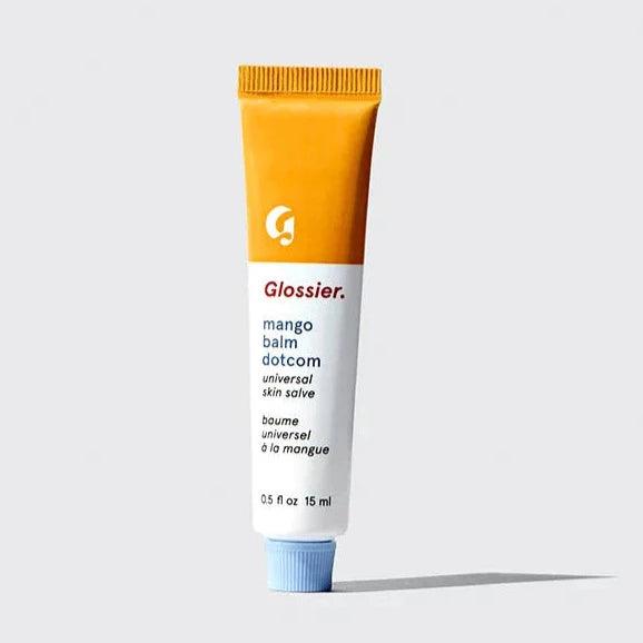 Glossier Balm Dotcom in Mango flavor, a hydrating lip balm tube for nourishing and moisturizing dry skin.