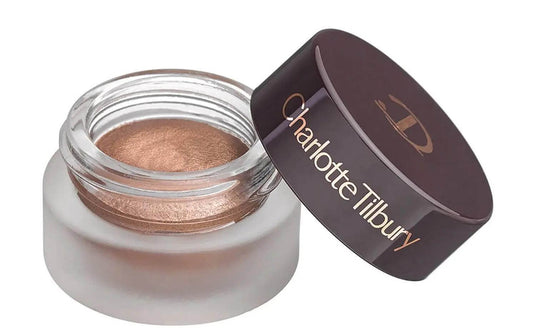 Charlotte Tilbury Cream Eyeshadow in Amber Gold - metallic finish in a glass pot, perfect for easy application.