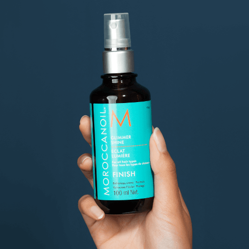 Moroccanoil Glimmer Shine Spray 100ml bottle showcasing luminous shine and argan oil benefits for all hair types.