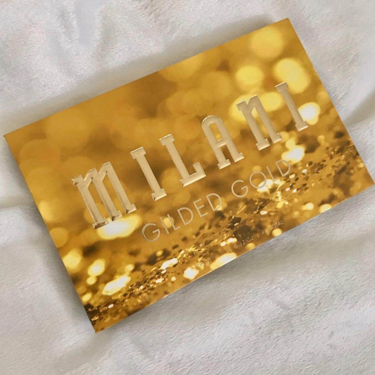 Milani Gilded Gold Palette with shimmering gold design, featuring the brand name in elegant letters.