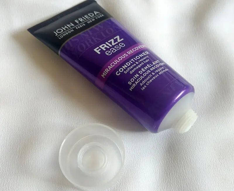 John Frieda Frizz Ease Miraculous Recovery Conditioner 50ml tube for damaged hair repair and moisturizing treatment.