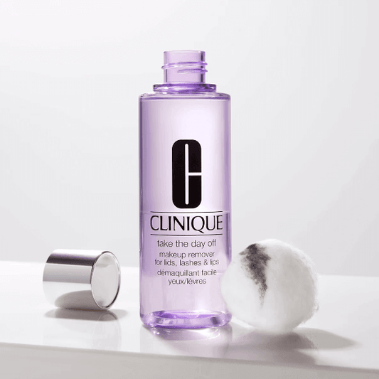CLINIQUE Take The Day Off makeup remover for lids, lashes & lips in a clear bottle with cotton pad, 125ml.