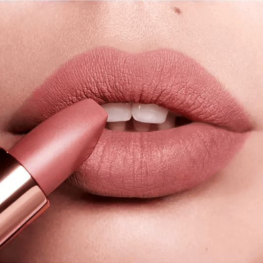 Close-up of Charlotte Tilbury Matte Revolution Lipstick in Pillow Talk applied on lips, showcasing a bold matte finish.