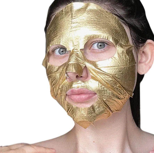 Close-up of a person wearing a BeautyPro Hyaluronic Acid Gold Foil Mask, showcasing its luxurious golden texture.