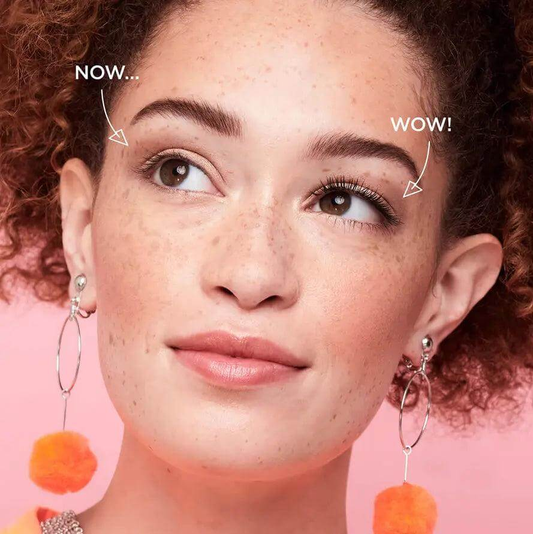 Before and after look of lashes using Benefit They're Real Lengthening Mascara in Jet Black on a model with curly hair.