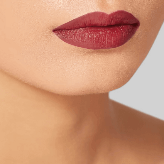 Close-up of lips wearing Charlotte Tilbury Hot Lips 2 Viva Le Vergara in a soft-wine shade.