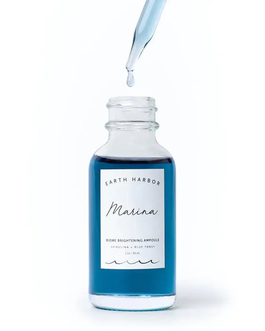 Earth Harbor Marina Biome Brightening Ampoule 30ml with dropper and ocean-blue liquid for radiant skin.