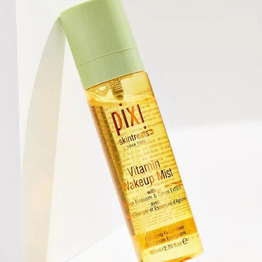 PIXI Vitamin Wakeup Mist 80ml bottle with green cap, infused with orange blossom and citrus extracts for revitalizing skin.