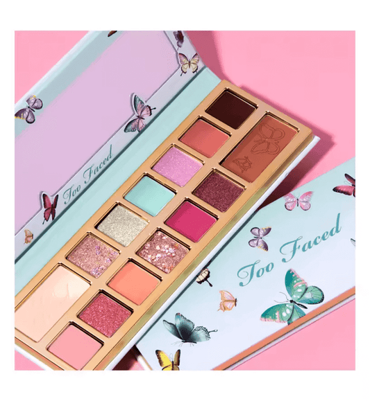 Too Faced Limited Edition Too Femme Ethereal Eye Shadow Palette featuring vibrant shades and butterfly designs on packaging.
