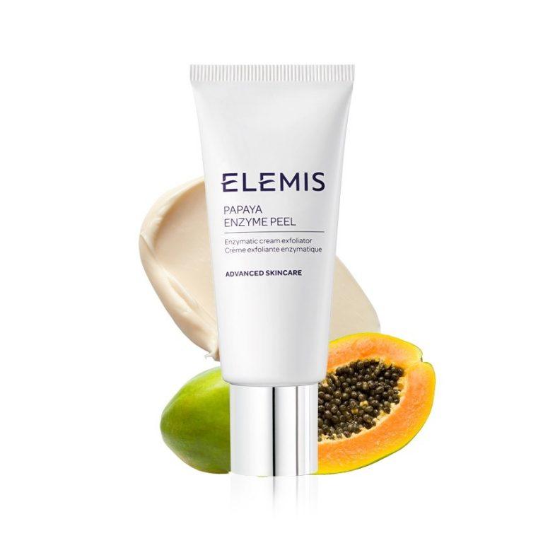 ELEMIS Papaya Enzyme Peel tube next to papaya and cream, a natural exfoliator for radiant skin.