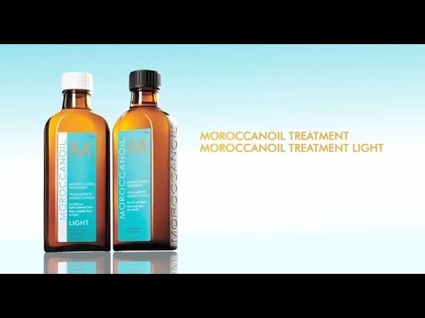 Two bottles of Moroccanoil Treatment and Moroccanoil Treatment Light on a light blue background.