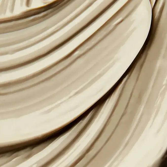 Close-up of ELEMIS Herbal Lavender Repair Mask, showcasing its smooth, creamy texture ideal for soothing dull skin.