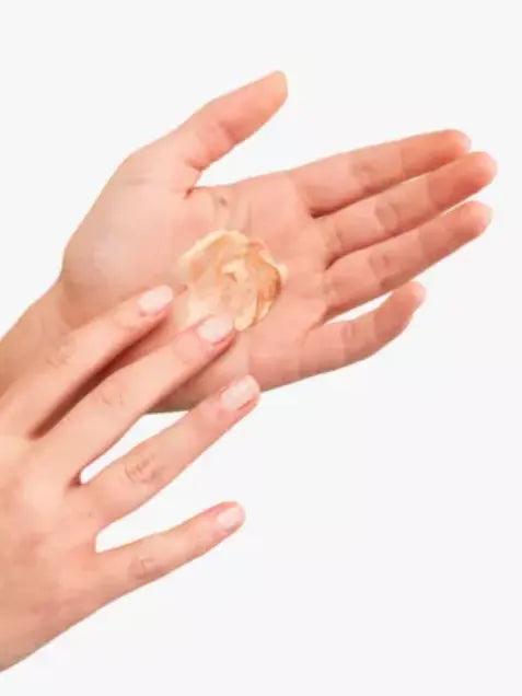 Pai Skincare bronzing drops being applied to hands for a natural glow, suitable for all skin tones.