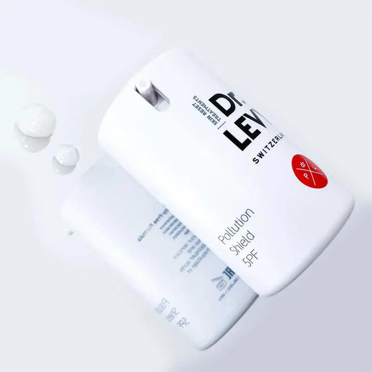 Dr. LEVY Switzerland Pollution Shield 5PF bottle with creamy texture, designed for skin protection against environmental hazards.