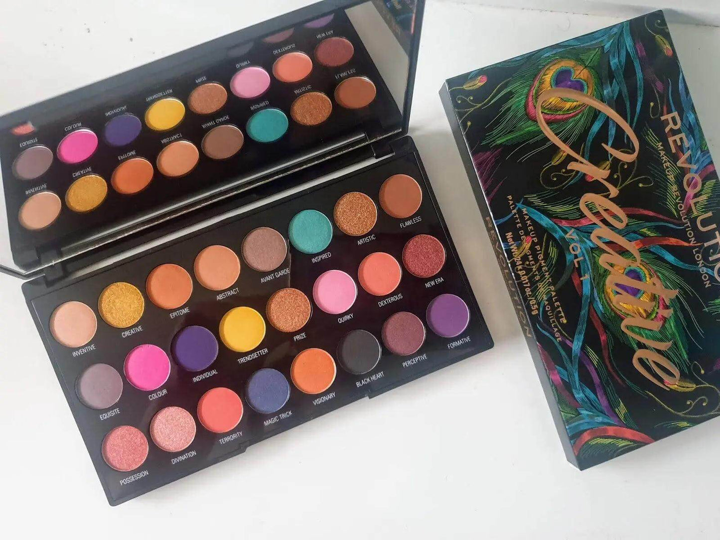 Makeup Revolution Creative Vol 1 Palette showcasing 24 vibrant eyeshadow shades in bold and shimmering finishes.