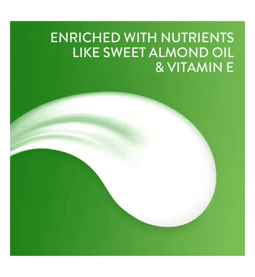 Cetaphil Rich Night Cream texture with sweet almond oil and vitamin E on a green background