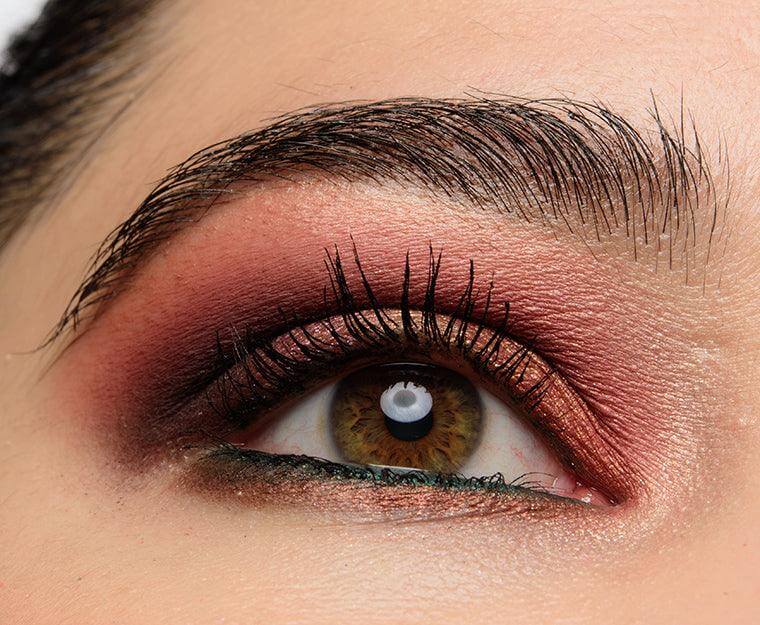 Close-up of a bold eye makeup look featuring vibrant shades from the NARS Extreme Effects Eyeshadow Palette.