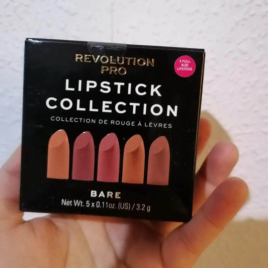 Revolution Pro Nude Lipstick Set Bare Collection in hand, showcasing five full-size creamy satin lipsticks.