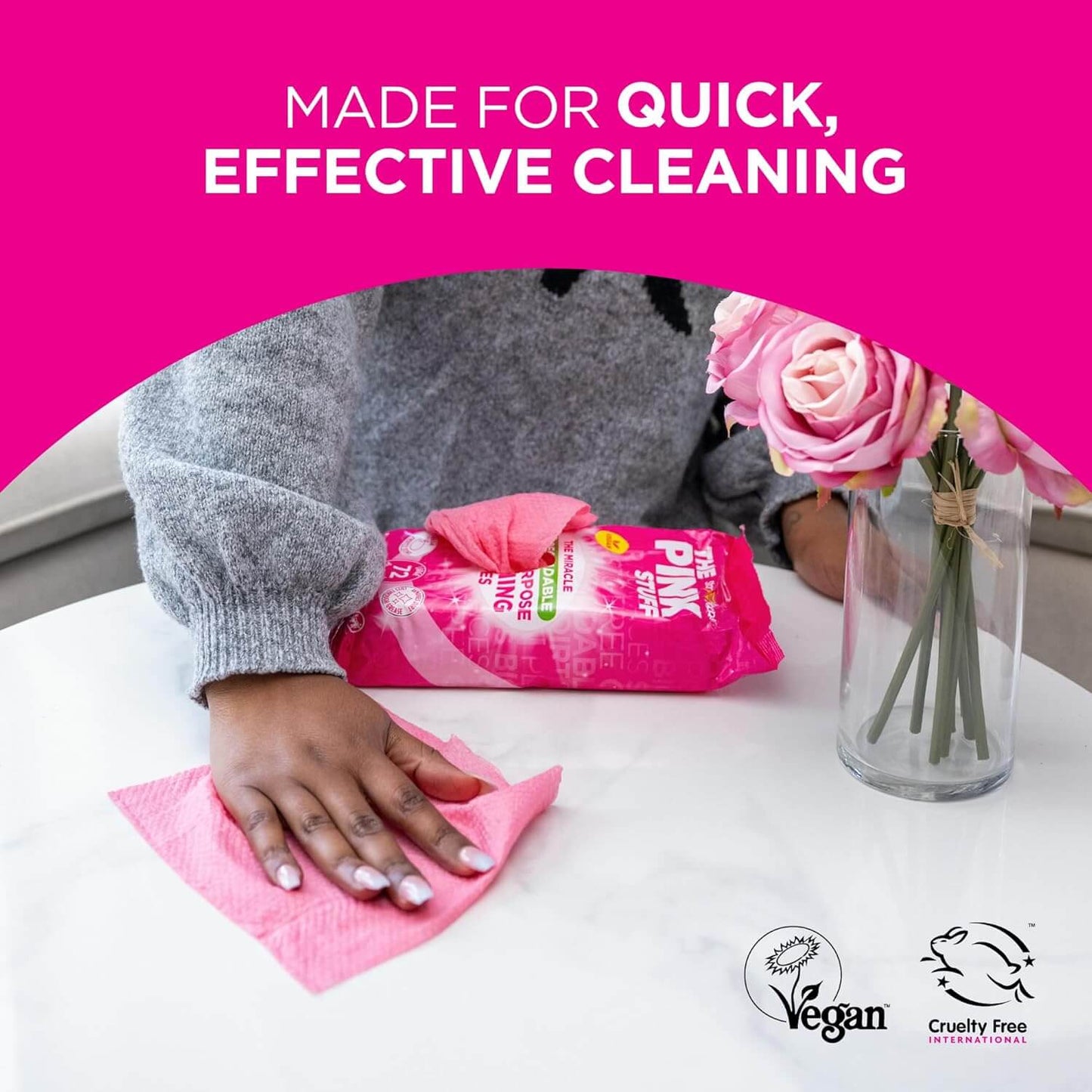 Person using The Pink Stuff biodegradable cleaning wipes on a surface, promoting quick and effective cleaning.