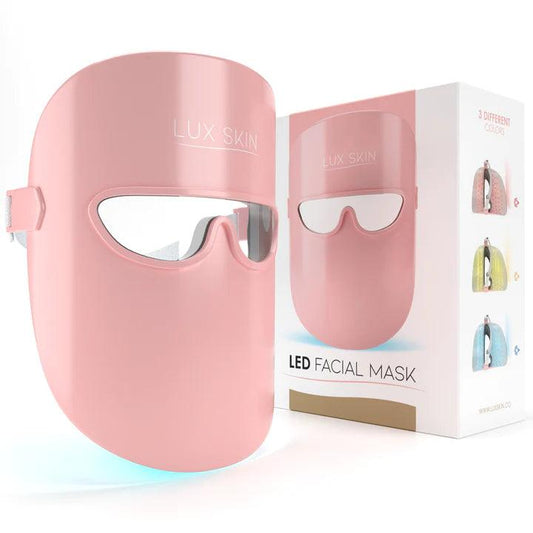 LUX SKIN LED Facial Mask in pink, promoting glowing skin, reducing wrinkles and acne with medical-grade LED therapy.