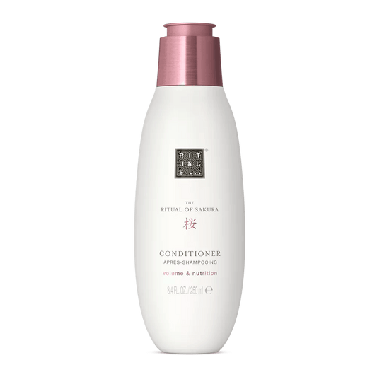RITUALS The Ritual of Sakura Conditioner bottle for smooth, voluminous hair, infused with rice extract and macadamia oil.