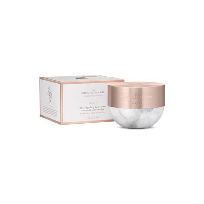 Rose gold and marble cream jar with packaging on a white background