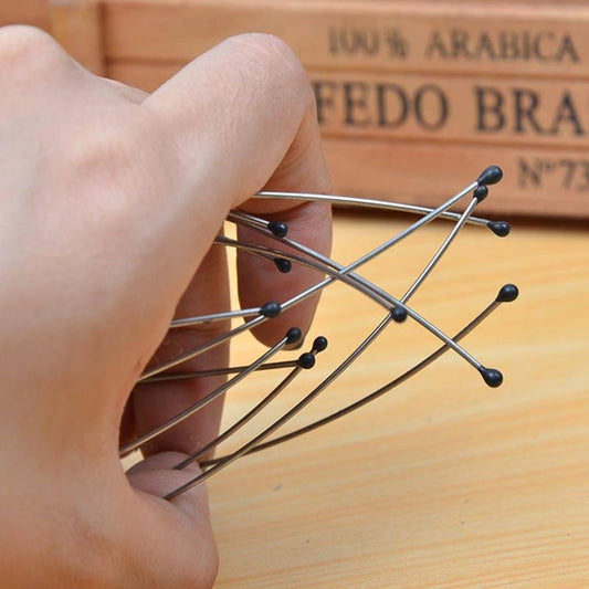 Hand holding an octopus head massager, demonstrating relaxation and stress relief benefits.