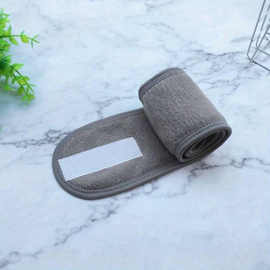 Soft grey adjustable hairband for women, perfect for washing face, yoga, sports, and running.