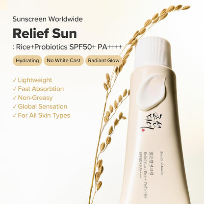 Sunscreen bottle with rice and probiotics SPF50+ PA++++ on a light background