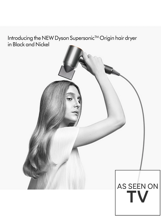 Person using a Dyson Supersonic hair dryer with text about the product and its availability.