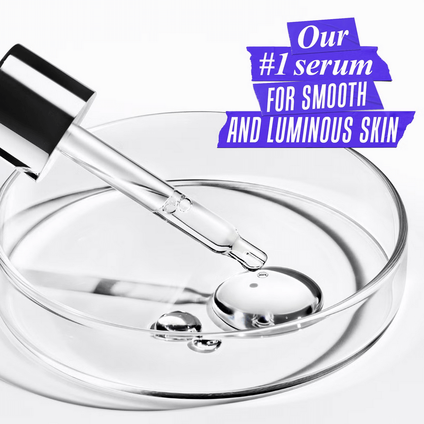 Kiehl's Clearly Corrective Dark Spot Solution serum in a petri dish for luminous and smooth skin.