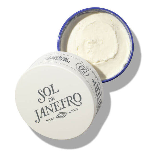 Sol de Janeiro Delicia Drench Body Butter in a white jar with a blue lid, showcasing its creamy texture.