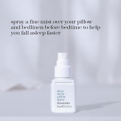 White spray bottle labeled thisworks 'deep sleep pillow spray' on a light gray background