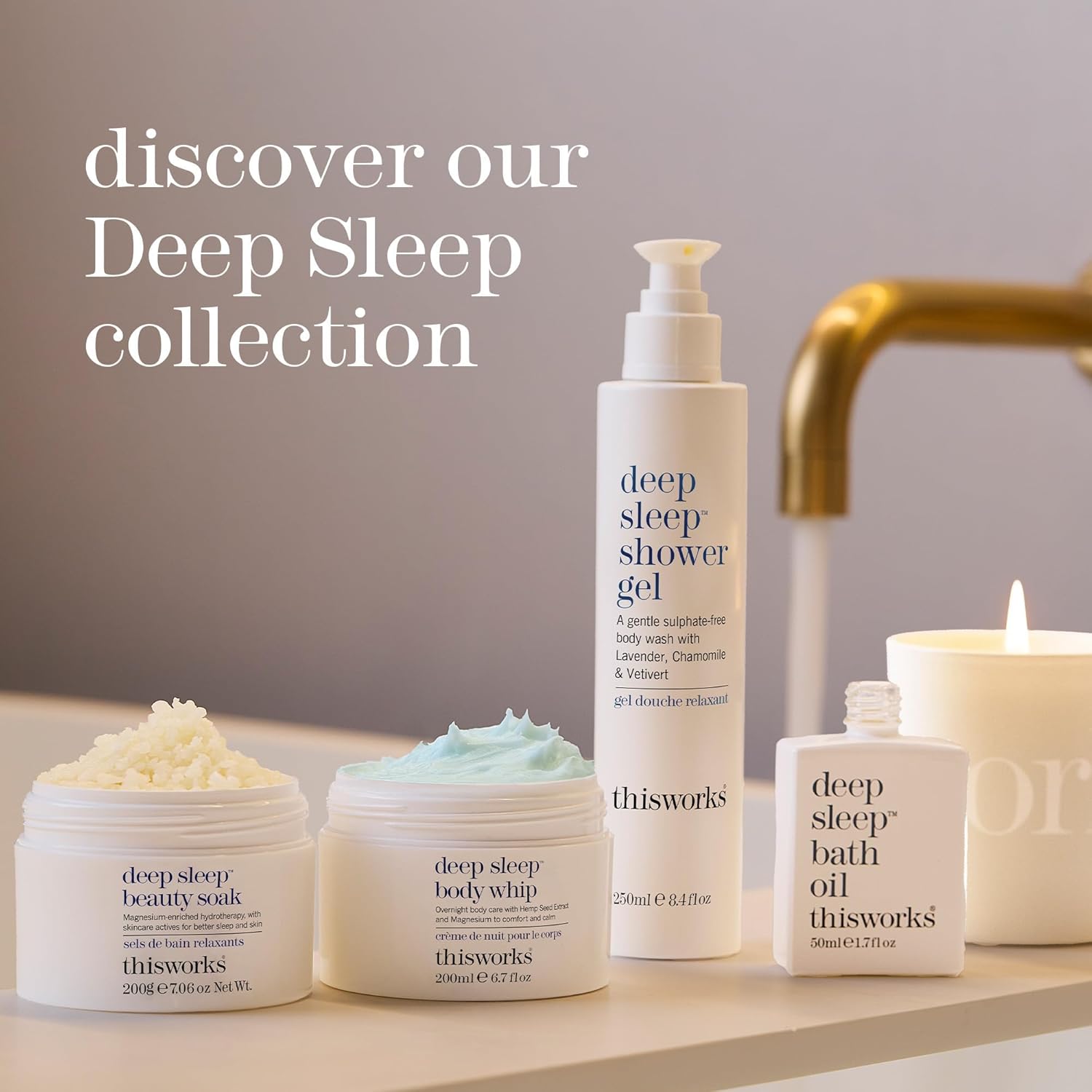 Collection of 'thisworks' deep sleep skincare products on a bathroom shelf with a candle.