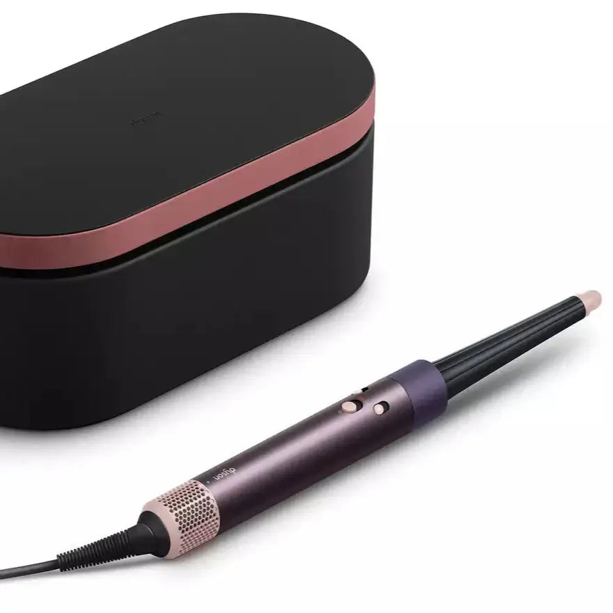 Dyson Airwrap ID Hair Styler Jasper Plum next to sleek storage case, perfect for curly to coily hair styling.