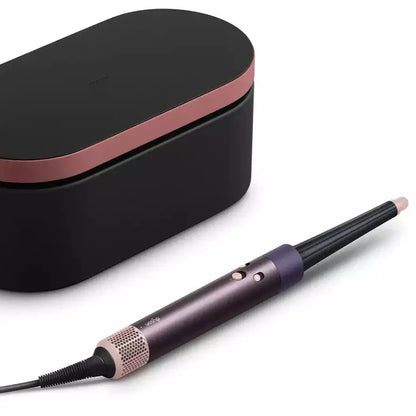 Dyson Airwrap ID Hair Styler Jasper Plum next to sleek storage case, perfect for curly to coily hair styling.