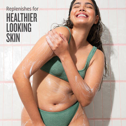 Sol de Janeiro Beija Flor Body Wash model smiling in shower with foamy skin for healthier looking skin
