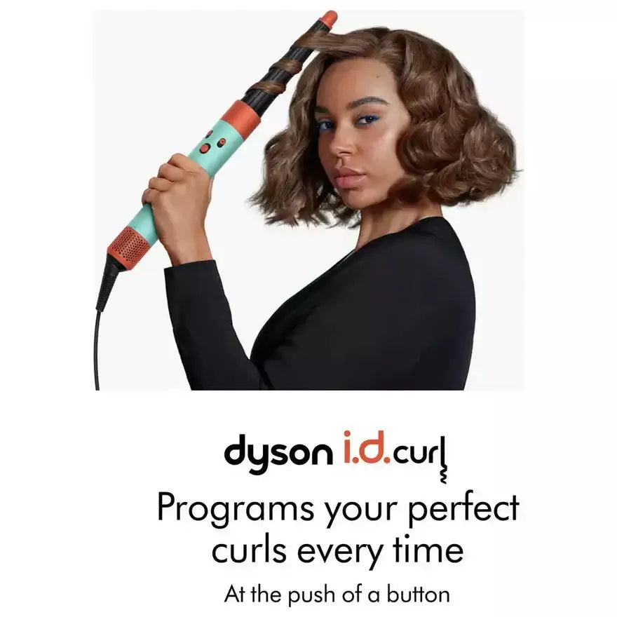 Dyson Airwrap ID Hair Styler in Jasper Plum with model showcasing curly styling at the touch of a button.