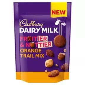 Cadbury Dairy Milk Fruitier & Nuttier Orange Trail Mix Bag 100g, suitable for vegetarians, includes almonds and hazelnuts.