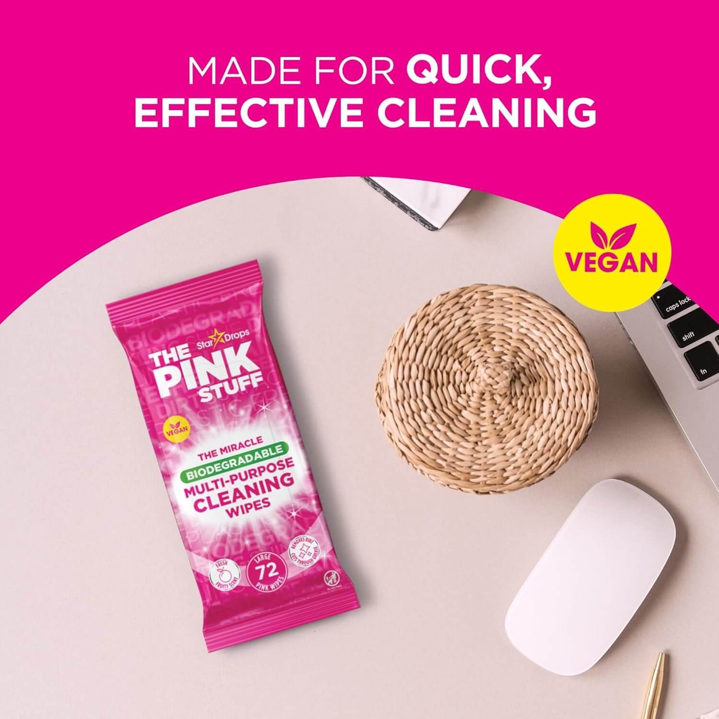 The Pink Stuff biodegradable multi-purpose cleaning wipes pack on a desk, highlighting quick effective cleaning features.