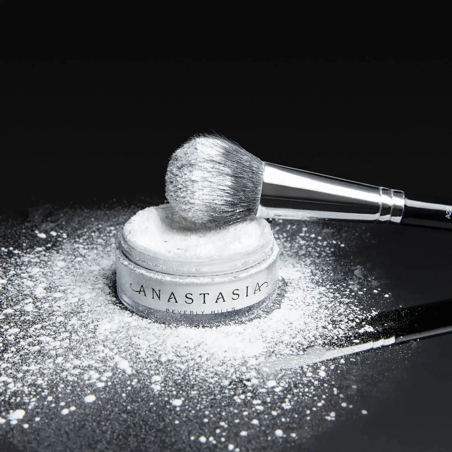Anastasia Beverly Hills Loose Setting Powder with brush, perfect for a flawless matte finish.