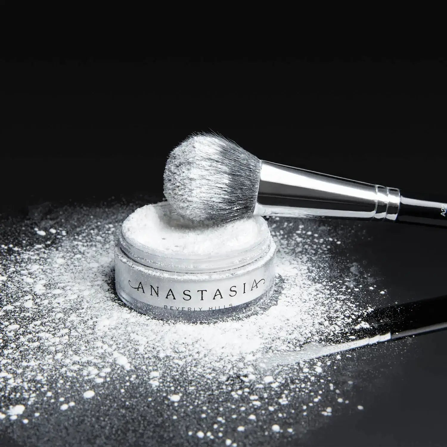 Anastasia Beverly Hills Loose Setting Powder with brush, perfect for a flawless matte finish.