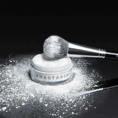 Anastasia Beverly Hills Loose Setting Powder with brush, perfect for a flawless matte finish.